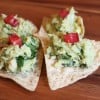 Avocado with tuna fish on tortilla chips
