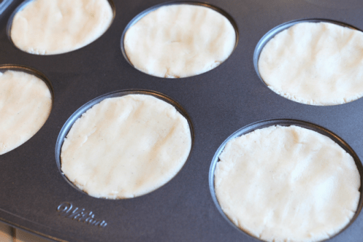 sugar cookie dough in Wilton Muffin Top Pan