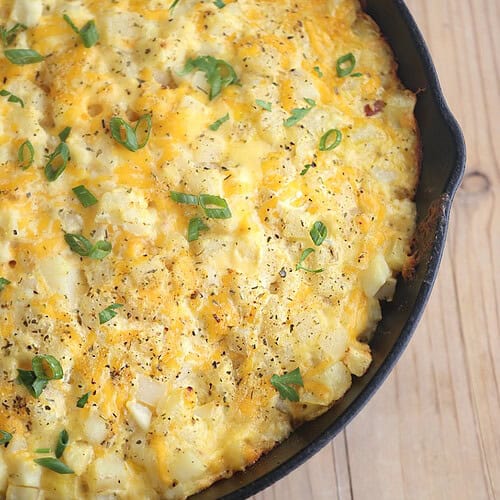 cast iron skillet, baked cheesy saucy potato casserole