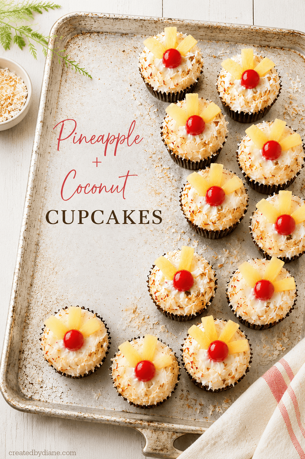 tray of pretty pineapple and coconut cupcakes with fruit on top createdbydiane