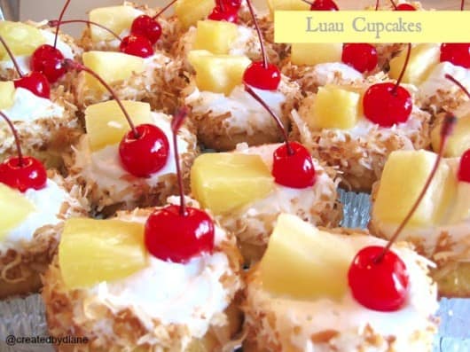 luau pineapple and toasted coconut with pineapple frosting topped with a cherry