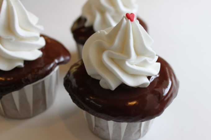 hot fudge style cupcakes with ganache, buttercream frosting and a heart sprinkle over chocolate cupcakes www.createdbydiane.com