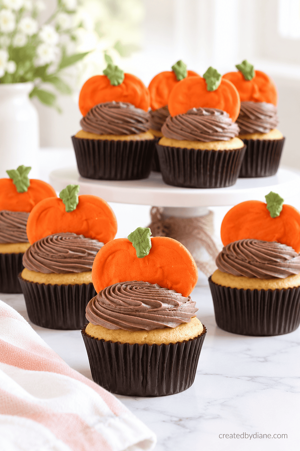 royal icing Pumpkins on Chocolate frosted cupcakes createdbydiane