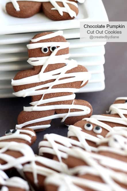 Chocolate Pumpkin Cut Out Cookies decorated like Mummys for Halloween @createdbydiane