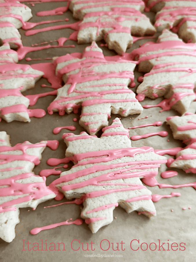 cut out snowflake cookies with pink drizzle icing createdbydiane