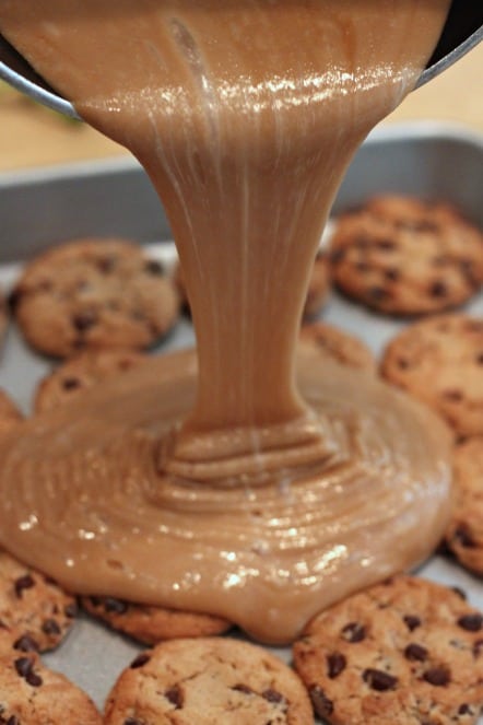 pouring toffee over chocolate chip cookies.jpg