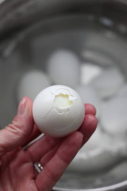 cracking hard boiled eggs.jpg
