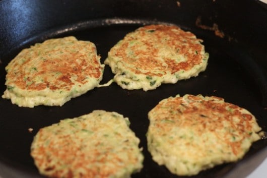 cooking zucchini cakes @createdbydiane