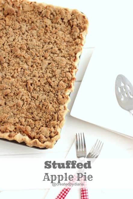 recipe from Created by Diane a delicious Stuffed Apple Pie with a yummy sour cream filling, that will remind you of cheesecake @createdbydiane #recipe #pie #piecrust #applepie #crumbtopping