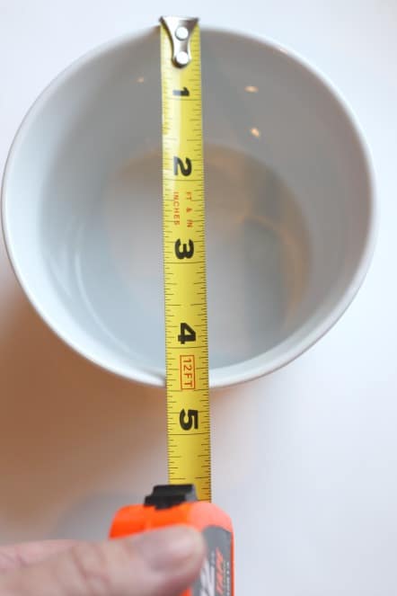 a bowl 1 inch larger than a mason jar lid