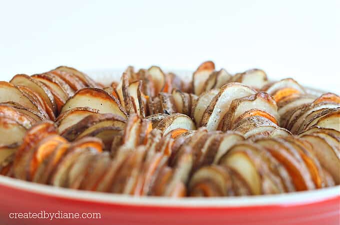 roasted russest potatoes and roasted sweet potatoes sliced and baked createdbydiane