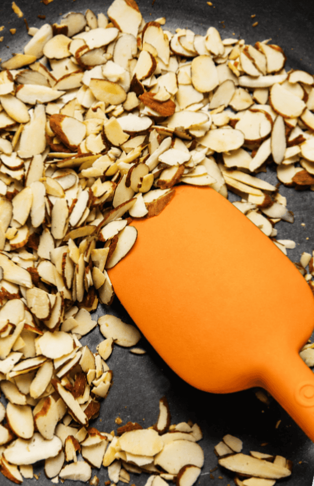 roasting nuts in a skillet on the stove