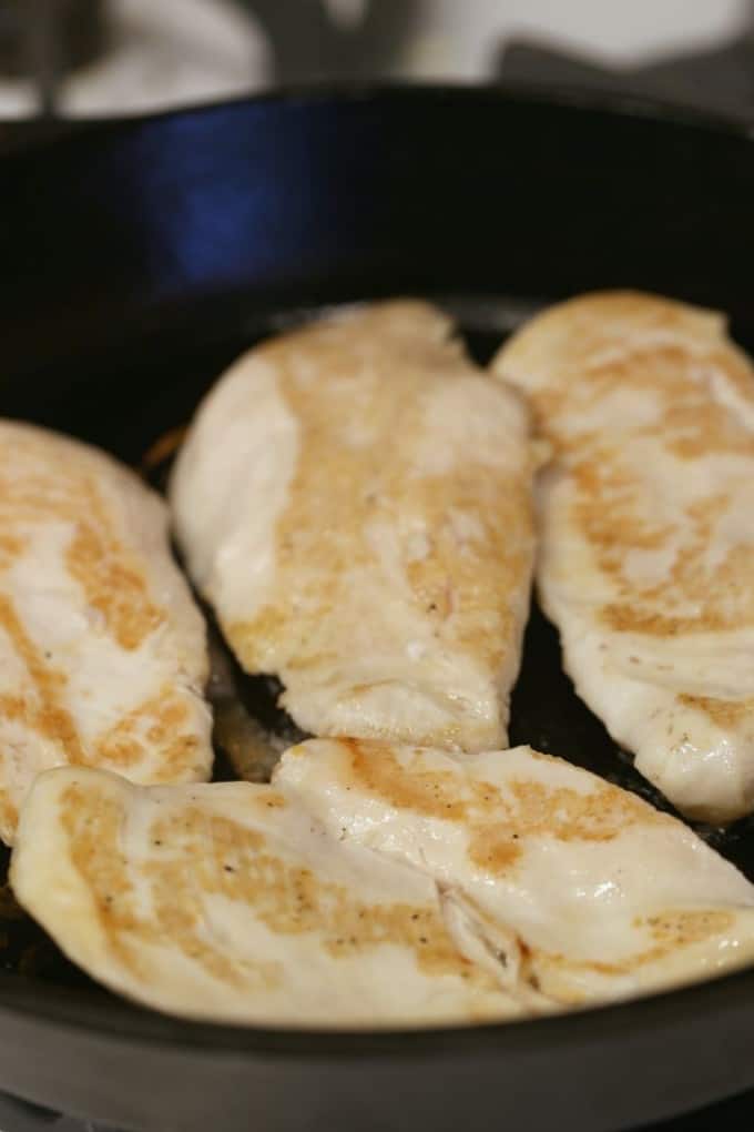 cooking chicken in a cast iron skillet @createdbydiane