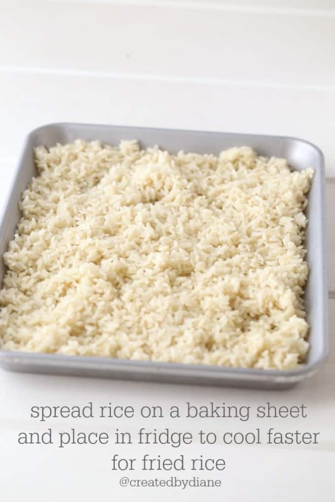 cooling rice on a baking sheet in the fridge will help get fried rice ready quicker than waiting for it to cool