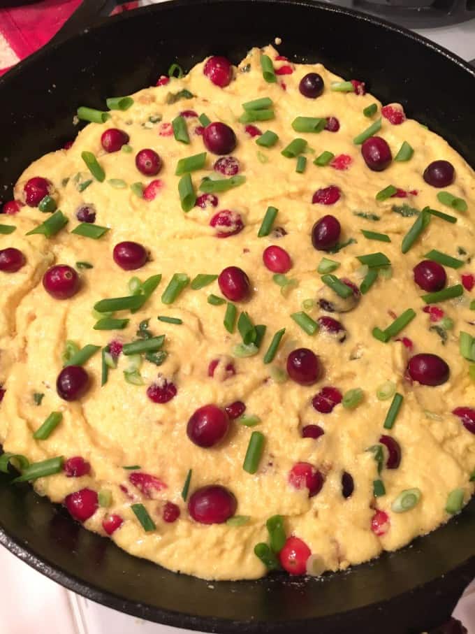 making holiday cornbread with cranberrries