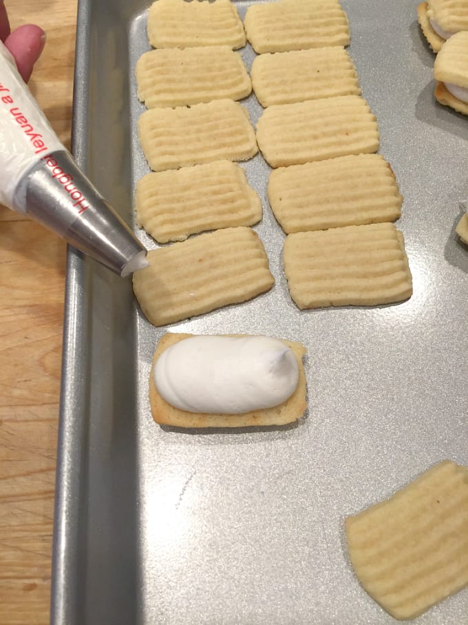 filling spritz cookies with frosting @createdbydiane