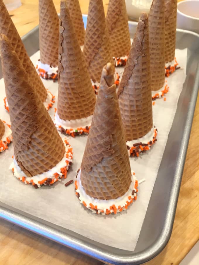 melted chocolate on cones with sprinkles