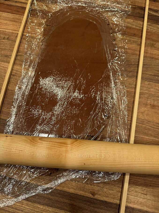 use plastic wrap instead of extra flour when rolling out cookies