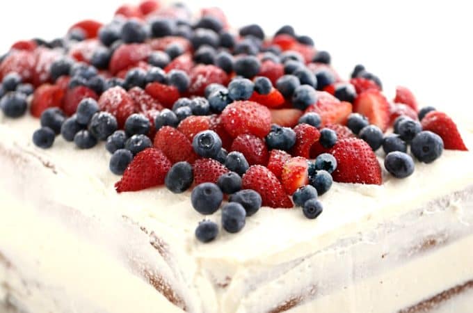 Vanilla Layer Cake topped with berries filled with pastry cream, the EVERY-TIME Cak