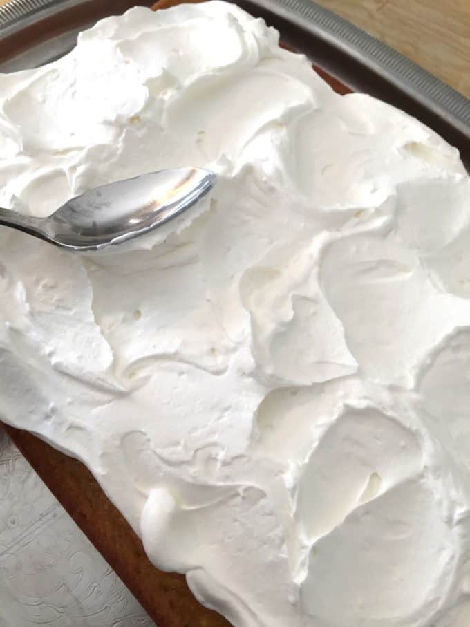 how to spread fluffy whipped cream on a cake @createdbydiane
