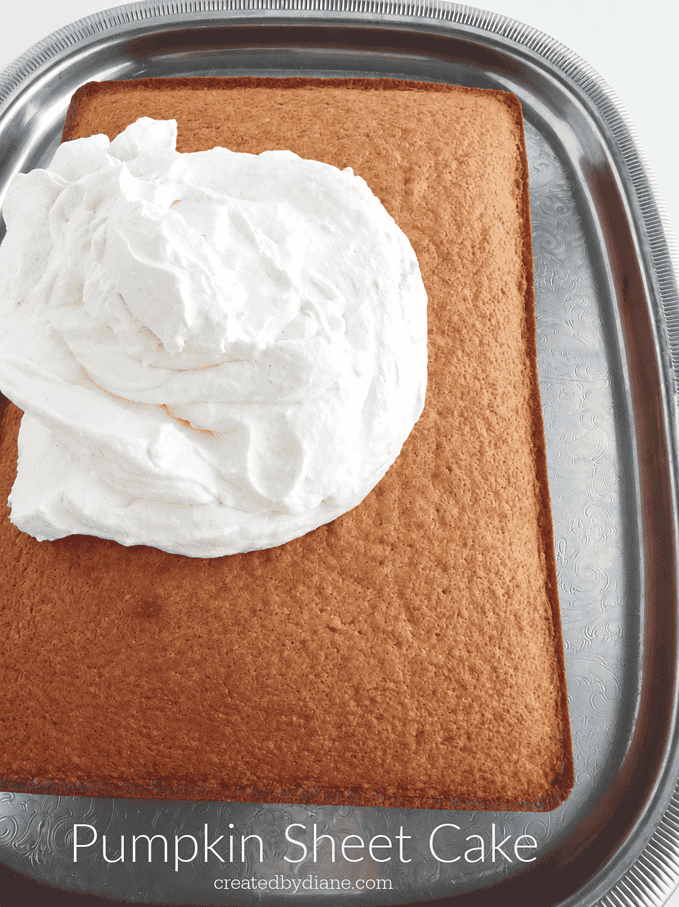 Pumpkin Sheet Cake 13x9 Recipe with whipped cream frosting on a silver platter