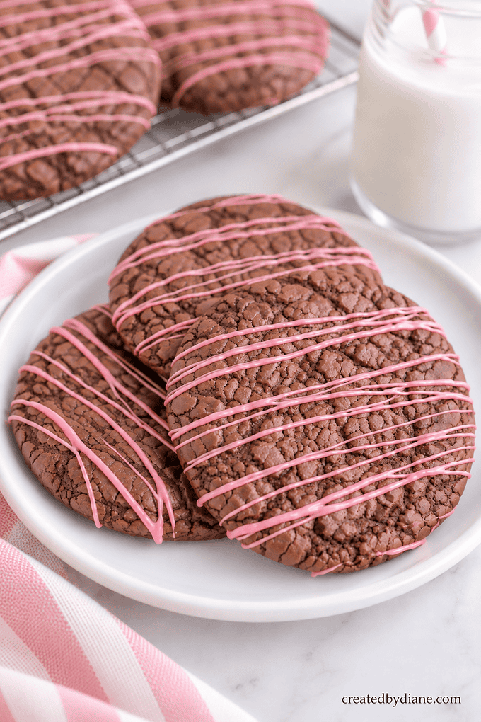 peppermint brownie cookies, with pink peppermint icing drizzled over top createdbydiane