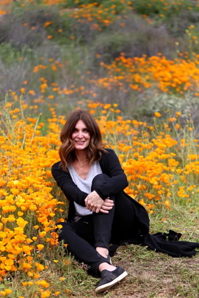 Diane Schmidt at poppy flower fields in Southern California's Super Bloom Created by Diane Food Blogger