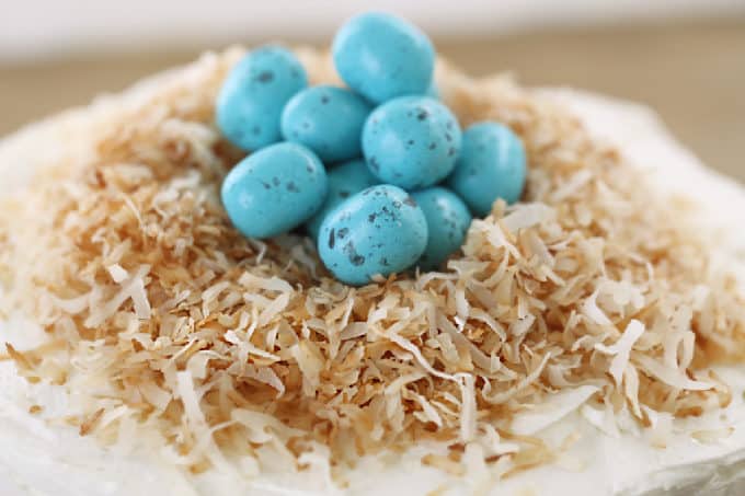 toasted coconut with robin eggs onto of coconut cake www.createdbydiane.com