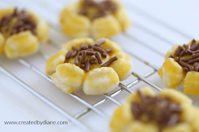 yellow sunflower cookies spritz with brown sprinkles www.createdbydiane.com