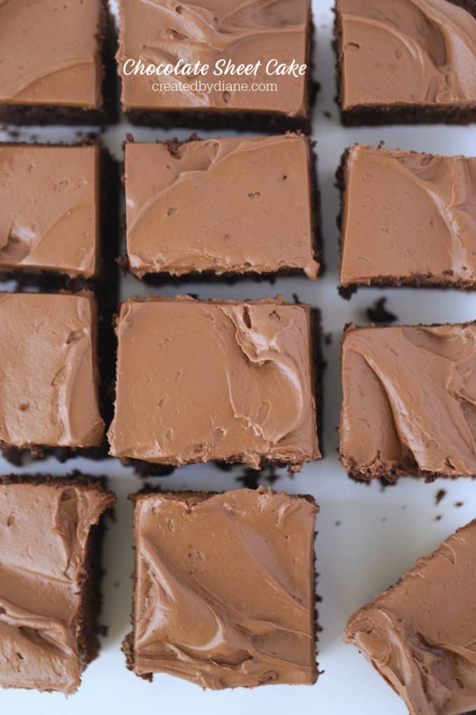 chocolate sheet cake with chocolate cream cheese frosting cut into squares