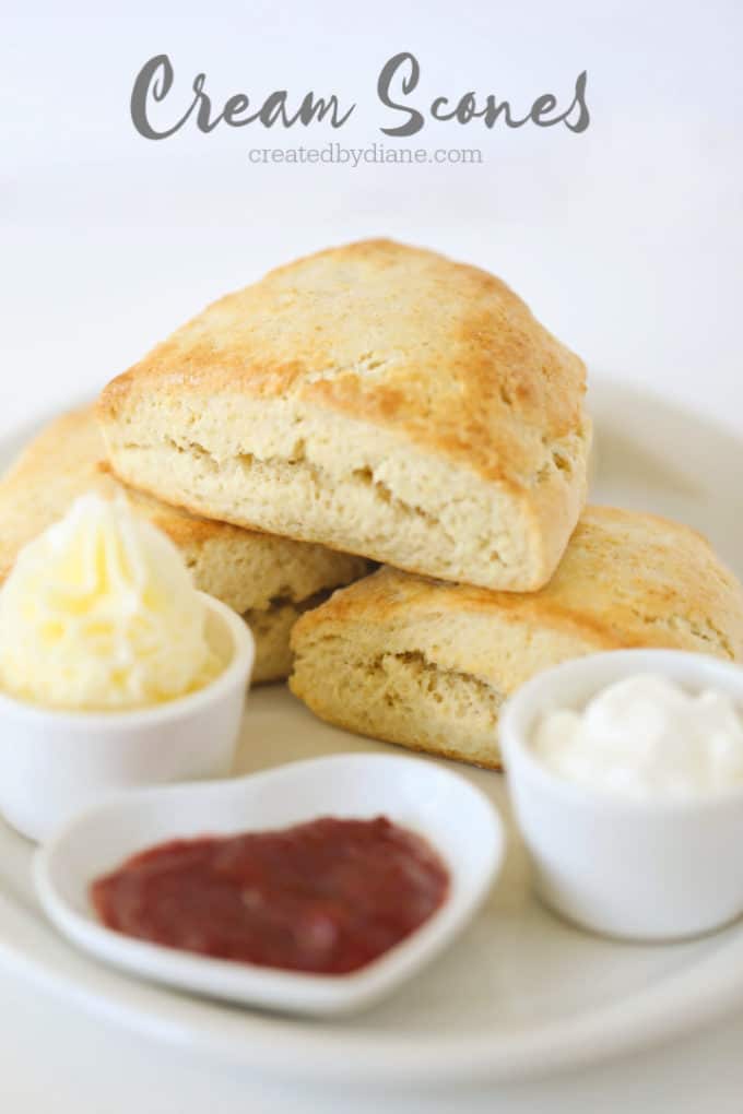 cream scones with butter, jam and whipped cream