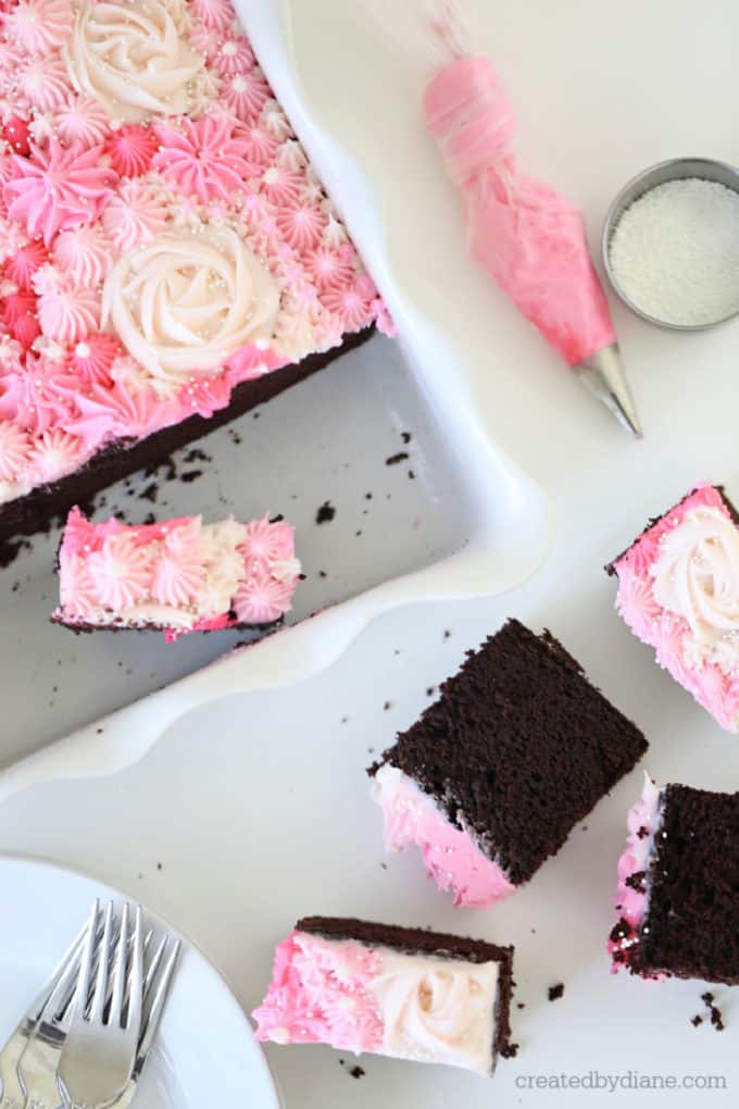 pink frosting decorated chocolate cake in the pan