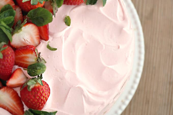 homemade strawberry cake, vanilla ckae with strawberry curd filling, topped with strawberry swiss meringue frosting createdbydiane.com