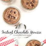 glass jars with chocolate mousse with chocolate curls on top