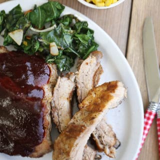 plate of tender pork ribs cooked in the instant pot with corn and collards and baked beans createdbydiane.com