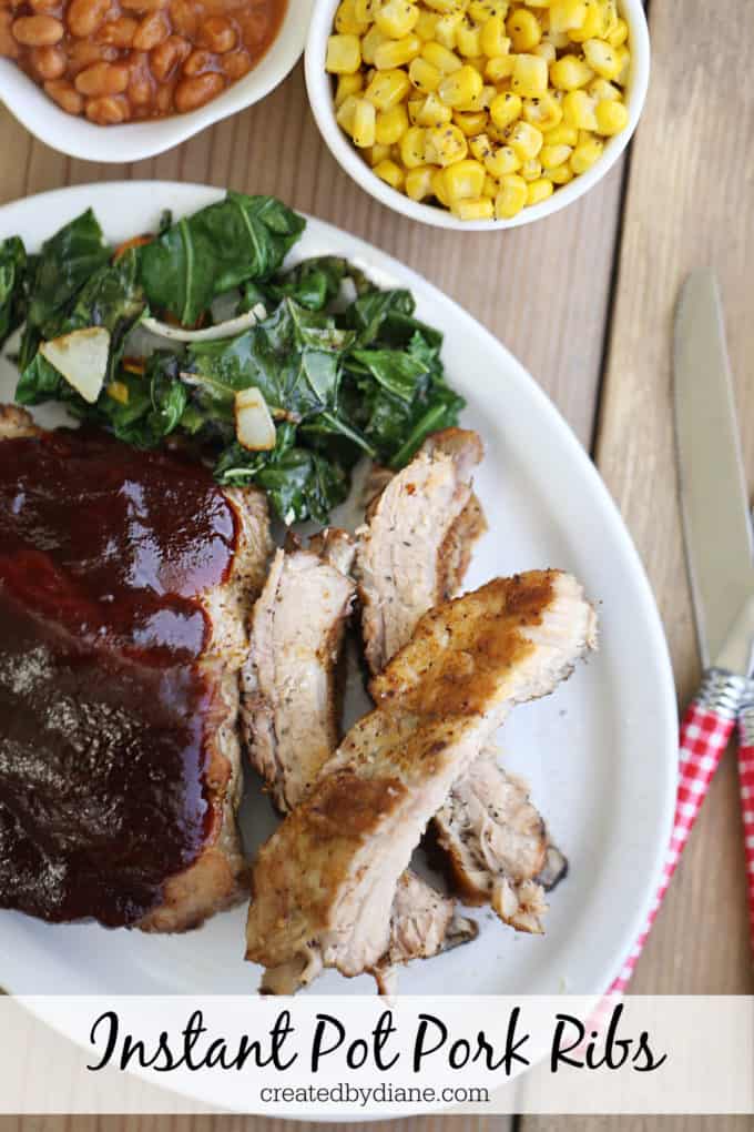 plate of tender pork ribs cooked in the instant pot with corn and collards and baked beans createdbydiane.com