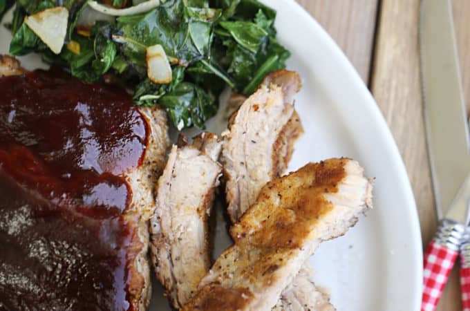 plate of tender pork ribs cooked in the instant pot with corn and collards and baked beans createdbydiane.com