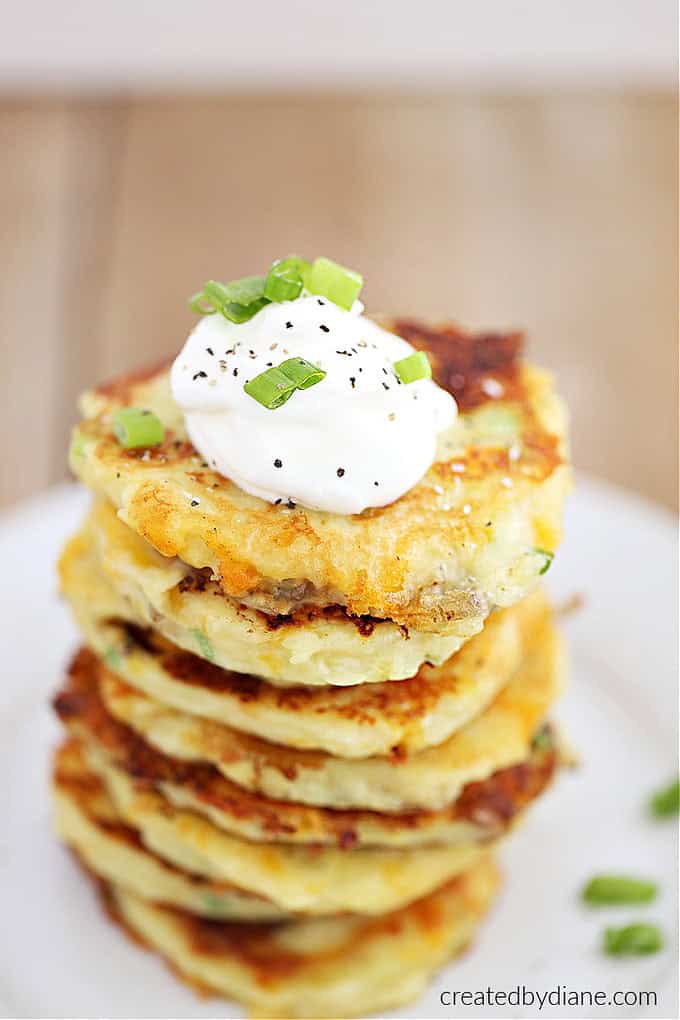 mashed potatoes mixed into delicious cakes stacked with sour cream on top createdbydiane
