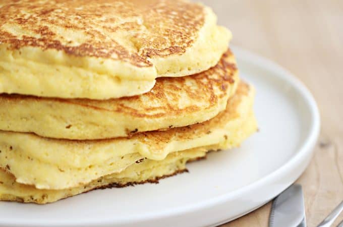 cornbread pancakes on a plate enjoy with syrup or sour cream, jam or butter, sweet or savory breakfast createdbydiane.com
