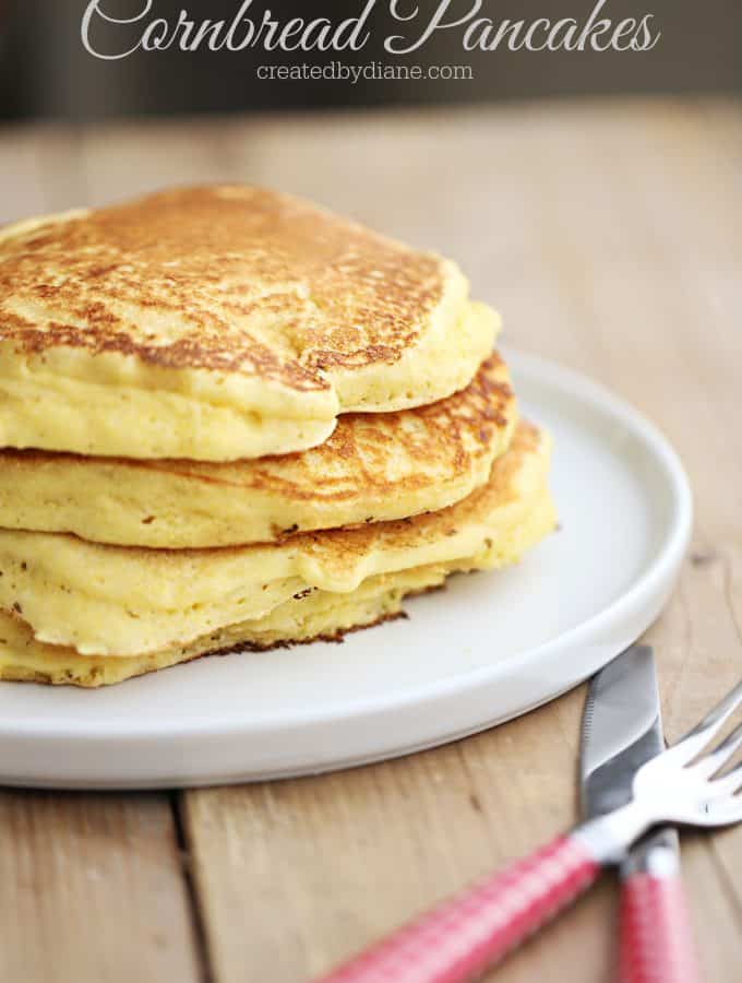 cornbread pancakes on a plate enjoy with syrup or sour cream, jam or butter, sweet or savory breakfast createdbydiane.com