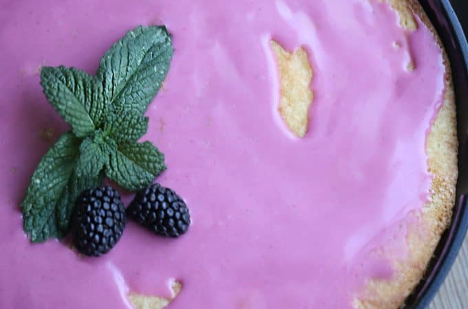 buttermilk cake baked in a cast iron skillet with pretty blackberry glaze createdbydiane.com