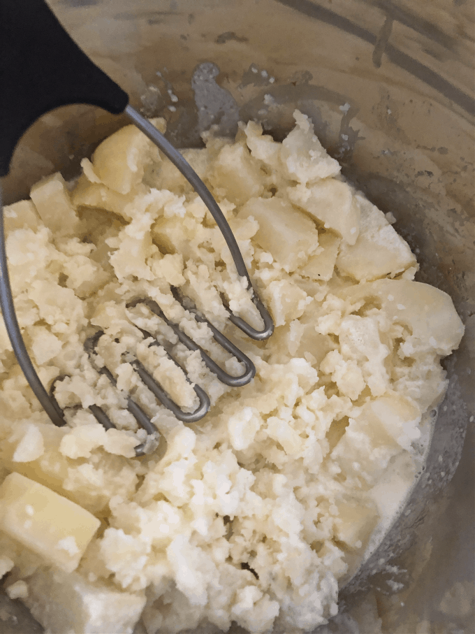 mashing potatoes by hand