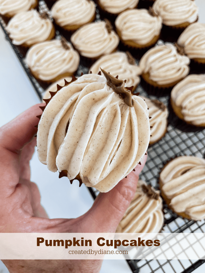 pumpkin flavor cupcakes cinnamon cream cheese frosting piped into pumpkin shapes createdbydiane.com