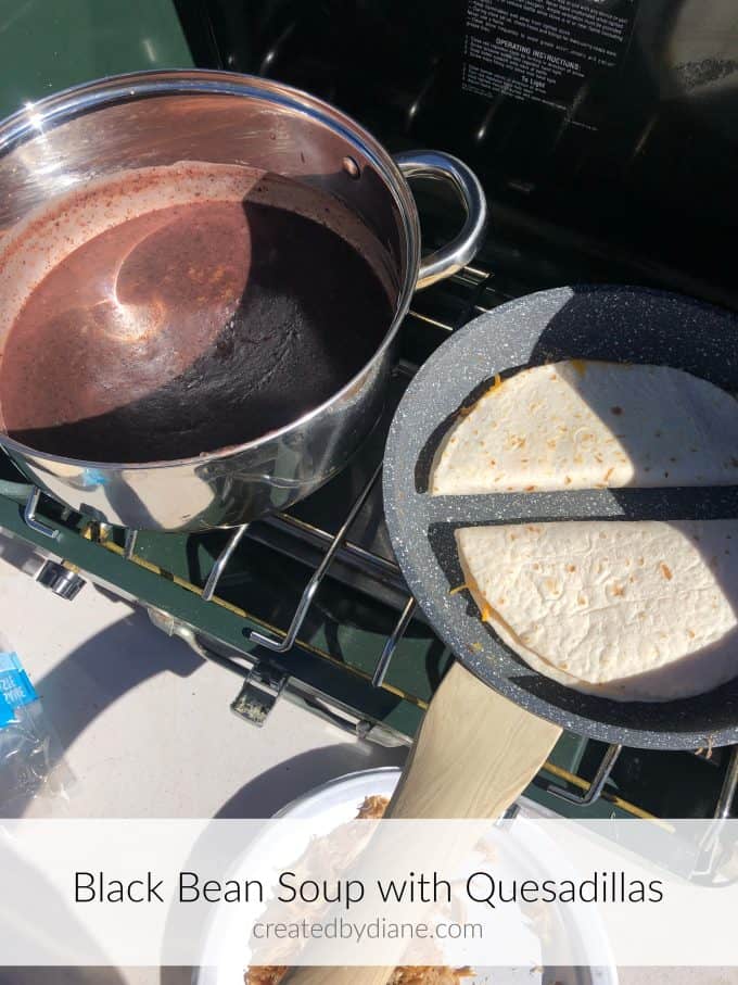 camping with a coleman stove and makingblack bean soup with quesadillas