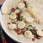 large white bowl of thick and creamy clam chowder, bacon, potato, clams createdbydiane.com
