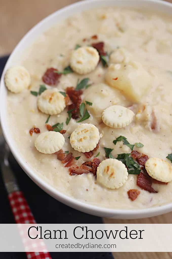 large white bowl of thick and creamy clam chowder, bacon, potato, clams createdbydiane.com