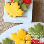 cut out leaf cookies with yellow, red, and green glaze icing