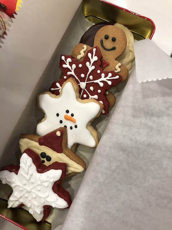 gift tin with decoraded christmas cookies