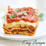 easy lasagna recipe, baked and sliced on a stack of white plates createdbydiane.com