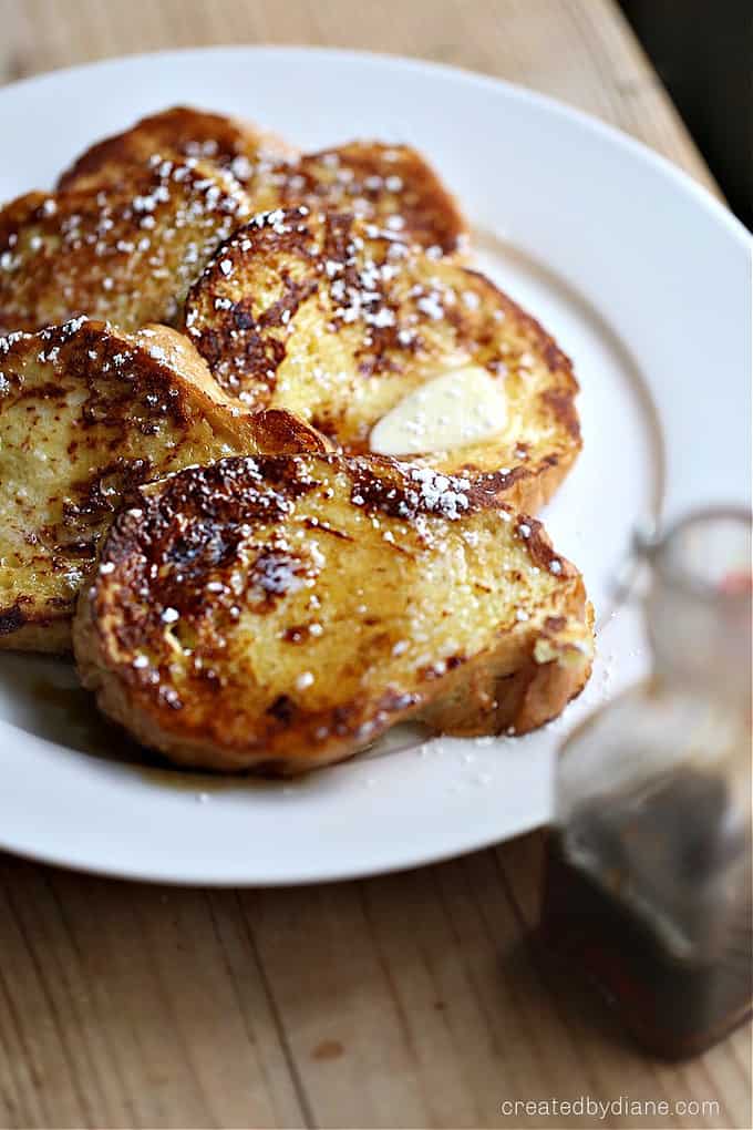 white plate with slices of cooked french bread French Toast